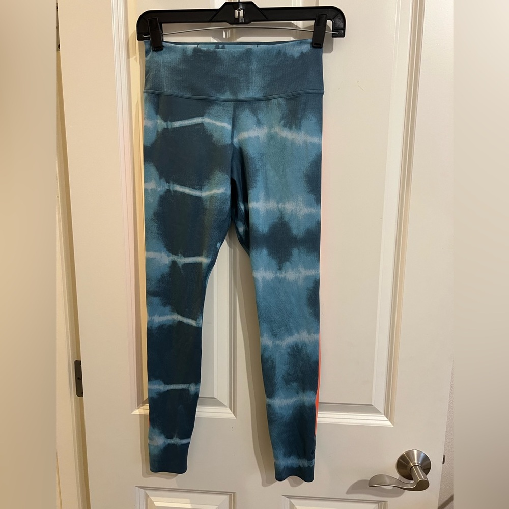 Nike dri fit one luxe blue leggings with orange stripe. Size small.